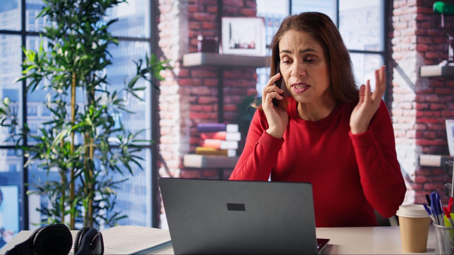 Concerned woman on the phone looking worried after receiving a fake lawyer call about a car accident claim.