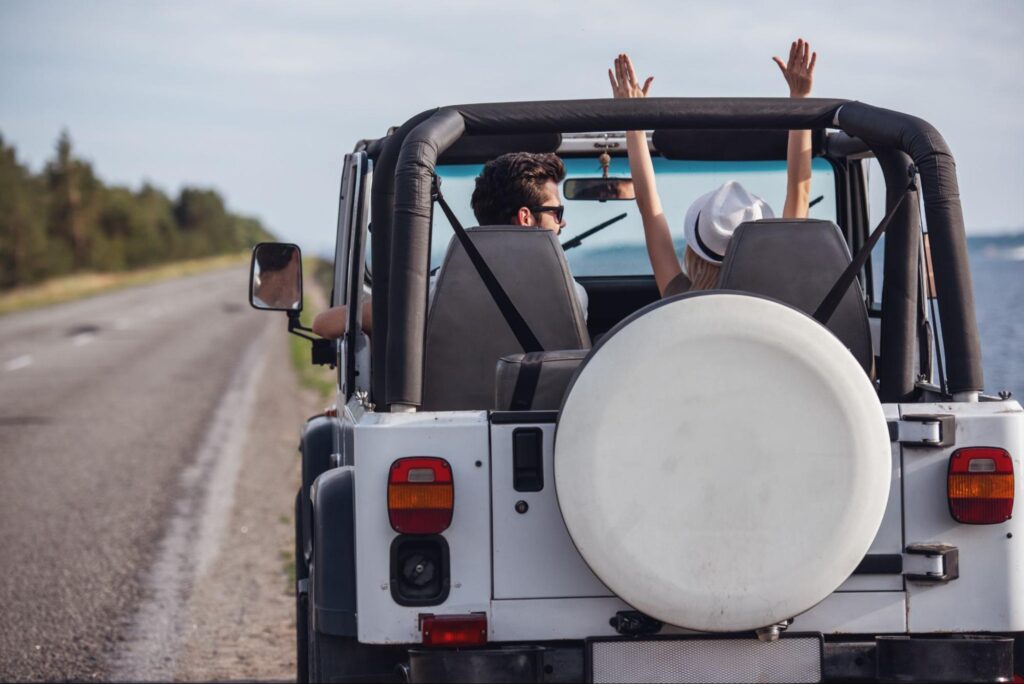 Couple enjoying a drive on a Florida highway during a busy holiday travel period
